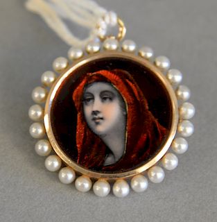 Gold and enameled pendant/brooch with portrait of woman with a red cowl in a gold frame and pearl surrounding, dia: 1 in., total wei...