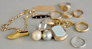 Gold lot to include faux pearl ring with 14K gold setting, hardstone locket, small rings, platinum ring, and 10K gold tag marked Mrs...