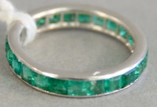 Platinum and emerald eternity band ring with square channel set emeralds marked with French assay mark, size 4 3/4, total weight 3.2 g