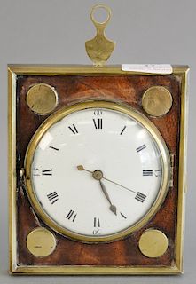 Early brass and wood wall clock having brass frame, enameled face and pocket watch works. 6 1/4" x 5 1/2".