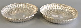 Pair of Irish silver circular dishes, 18th/19th century, circular form with fluting and centering an engraved crest. ht. 2 in., dia....
