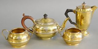 Four piece English silver lot with three piece tea set plus small tea pot, all with gold wash, 23.3 t.oz