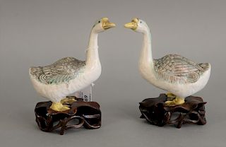 Pair of Chinese porcelain models of geese on carved lily pad base. ht. 6 1/4 in.