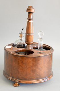Regency mahogany bottle carrier with circular body cut out for three bottles. ht. 15 in., dia. 10 1/2 in.