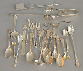 Group of sterling silver spoons, tongs, and serving pieces; one Tiffany, 18.4 t.oz