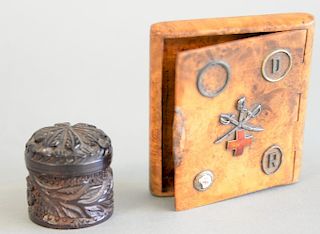 Two small boxes to include burl cigarette or card case mounted with silver and gold rings and an enameled cross, along with a small ...