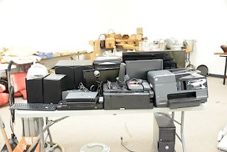 Large group of electronics to include computer screens, two printers, three DVD blu ray players, speakers, etc.