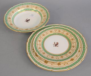Set of fifty four Rockingham works crested peach and green ground dinner service, lion arms in center to include eighteen dinner pla...