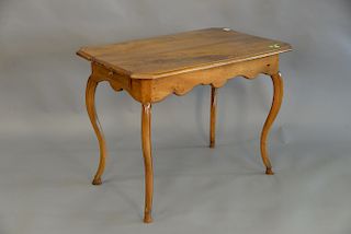 Louis XVI provincial walnut writing table fitted with a frieze drawer at each end, shaped apron with the cabriole legs terminating i...