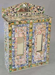 Porcelain shard encrusted and tiled cabinet. ht.48 1/2 in., wd. 34 in.