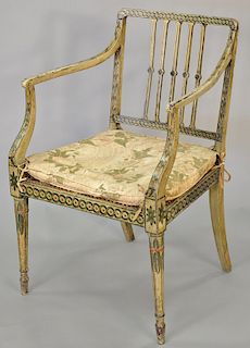 Edwardian Adam style painted arm chair with caned seat.