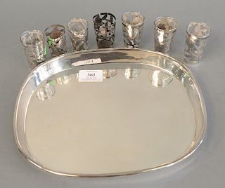 Eight piece lot to include Mexican silver assembled drink set, 20th century, to include an oblong tray, five various cups with glass...