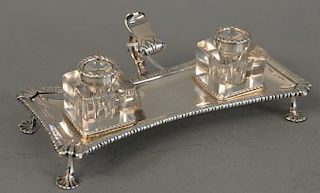 George III silver inkstand, London, 1771, snuffer's stand set with two glass inkwells. ht. 2 1/2 in., wd. 7 1/4 in., lg. 7 1/4 in. 7...