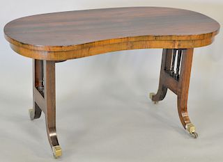 Regency rosewood low table, 19th century kidney form top on trestle supports. one chip on edge. top: 33" x 17", ht. 18 in.