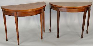 Two George III mahogany demilune game tables with square tapering legs, late 18th century, ht. 28 1/2 in., wd. 36 in., dp. 17 1/2 in.