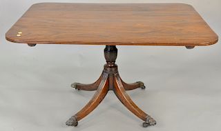 George IV mahogany breakfast tip table with brass paw feet. 27 1/2 in., top: 38" x 50", 19th century