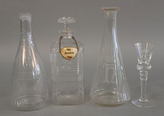 Group of hand blown glass to include a pair of decanters with etched glass crown, set of eight tall stemmed glasses with etched glas...