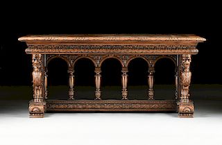 AN ITALIAN RENAISSANCE REVIVAL CARVED WALNUT LIBRARY TABLE, EARLY 20TH CENTURY,
