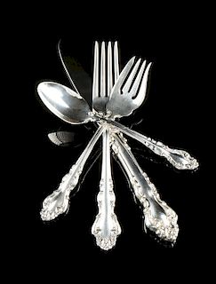 A FIFTY-SEVEN PIECE REED & BARTON STERLING SILVER FLATWARE SERVICE, SPANISH BAROQUE PATTERN, MARKED, LATE 20TH CENTURY,