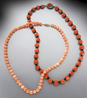 Two red coral necklaces.