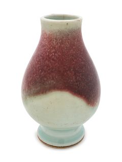 A Chinese Red Glazed Porcelain Bud-Form Vase
Height 5 1/8 in., 13 cm.