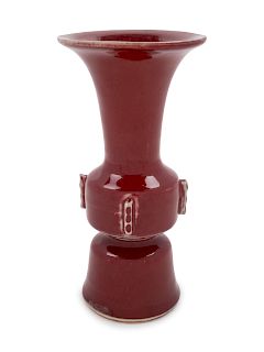 A Chinese Copper Red Glazed Porcelain Gu Vase
Height 7 in., 18 cm.