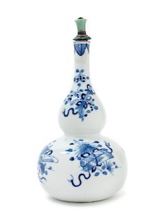 A Chinese Blue and White Porcelain Gourd-Form Vase 
Height 7 1/2 in., 19 cm.