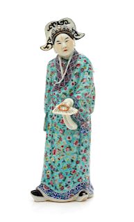 A Chinese Famille Verte Porcelain Standing Figure
Height 10 3/4 in., 27 cm. 