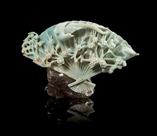 A Chinese Apple Green and Celadon Jadeite Fan-Form Carving
Length 10 in., 25.4 cm.