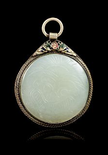 A Chinese White Jade Inset Silver Pendant 
Diam of jade 1 3/4 in., 4.4 cm. 