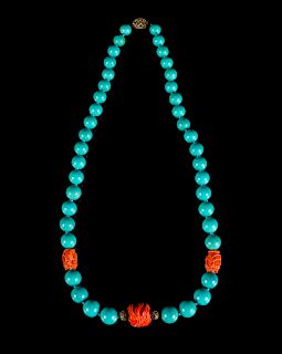 A Chinese Turquoise and Coral Beaded Necklace
Length 12 in., 30 cm.