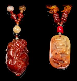 Two Chinese Jadeite, Amber, Hardstone, Peking Glass and Plastic Necklaces
Larger: length 18 in., 46 cm. 