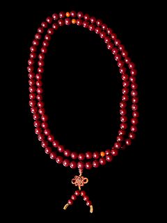 A Strand of Chinese Hardwood Prayer Beads
Length 27 1/2 in., 70 cm.