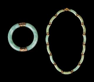 A Chinese Green Jadeite Necklace and Bracelet
Bangle: diam 3 1/4 in., 8 cm. 