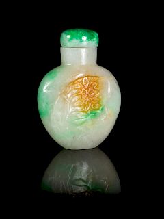 A Chinese Apple Green, Celadon and Russet Jadeite Snuff Bottle
Height 2 in., 5 cm.