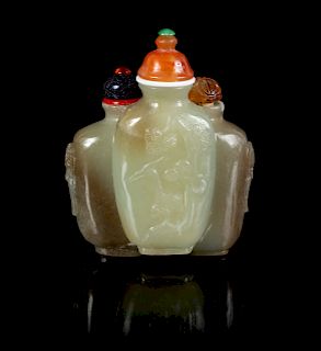 A Chinese Carved Celadon and Grey Jade Snuff Bottle
Height 2 1/4 in., 6 cm.