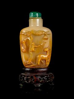 A Chinese Carved Agate Snuff Bottle
Height 2 3/8 in., 6 cm. 