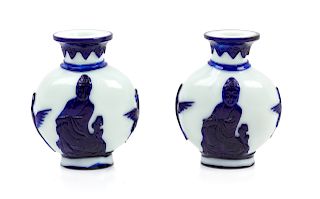 A Pair of Chinese Sapphire-Blue Overlay White Peking Glass Bottle Vases
Each: height 5 3/4 in., 15 cm. 