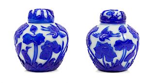 A Pair of Chinese Sapphire-Blue Overlay White Peking Glass Ginger Jars and Covers
Each: height 5 3/4 in., 15 cm. 