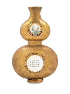 A Chinese Canton Enamel and Gilt Bronze Gourd-Form Wall Vase
Height 7 in., 17.8 cm. 