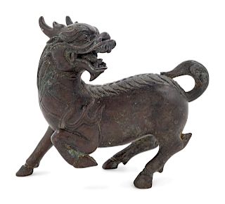 A Chinese Bronze Figure of a Qilin
Height 5 in., 13 cm.