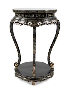A Chinese Gilt Decorated Black Lacquered Side Stand
Height 35 1/4 x width 20 1/4 x depth 16 1/2 in., 90 x 51 x 42 cm.