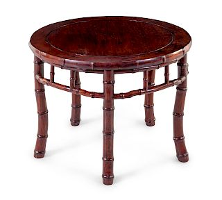 A Chinese Rosewood 'Imitation Bamboo' Round Table
Height 20 1/2 in., 52 cm.
