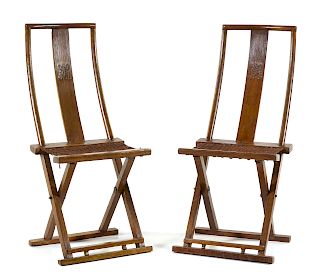 A Pair of Chinese Nanmu Folding Chairs 
Height 42 x length 19 x width 13 1/2 in., 107 x 48 x 34 cm.