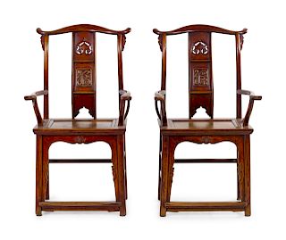 A Pair of Chinese Elmwood Armchairs
Each: height 45 3/4 in., 116 cm.