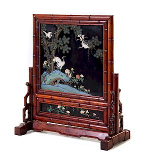 A Large Chinese Painted and Black Lacquered Hardwood Floor Screen
Height 46 1/4 x width 35 1/2 x depth 18 in., 117 x 90 x 46 cm.