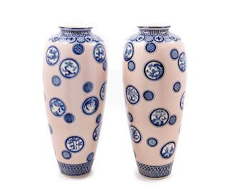 A Pair of Japanese Blue Decorated Porcelain Vases
Height 17 1/2 in., 44 cm.