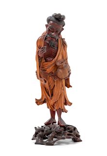 A Japanese Carved Wood Figure of a Fisherman
Height 10 1/2 in., 27 cm.