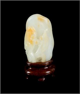 A Chinese Russet and White Jade Carving of Lingzhi
Height 1 3/4 in., 4 cm. 