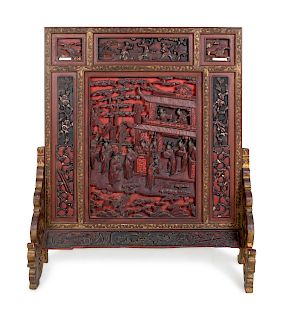 A Large Chinese Carved Red Lacquer Wood Table Screen
Height 35 x width 30 x depth 11 1/2 in., 88.9 x 76.2 x 29.2 cm. 